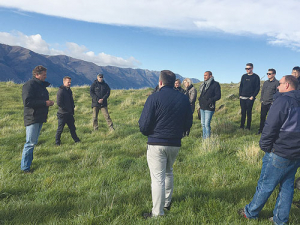 Jonathan Wallis of Minaret Station (left) shows an international group of chefs and food writers around his Alliance-supplying farm near Queenstown.