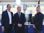 Agriculture Minister Todd McClay flanked by LIC chief executive David Chin (left) and chair Corrigan Sowman in the methane research barn.