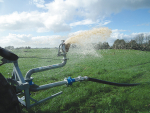 The oscillating spreading head moves left to right as effluent hits the plate, creating large droplets that fall gently to the ground.