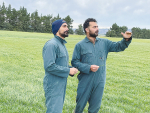 Jaspal Singh and his brother and farm employee Gurpal Singh discuss pasture cover on the farm.