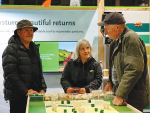 AgResearch’s Katherine Tozer (middle) explaining deferred grazing at the Fieldays.